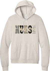 Glitzy Patterned Nurse hoodie in Heather Dust, featuring NURSE block letters in checkerboard, leopard, and polka dot patterns with a gold glitter outline and nurse script