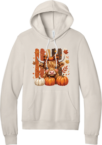 Highland Cozy hoodie in Heather Dust, featuring a fluffy highland cow calf in a buffalo check bow with pumpkins and painted autumn stripes