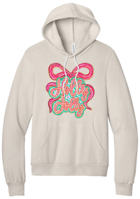 Holly Jolly Bow Script hoodie in Heather Dust, featuring pink gingham Holly Jolly script on a teal badge framed by a big pink bow