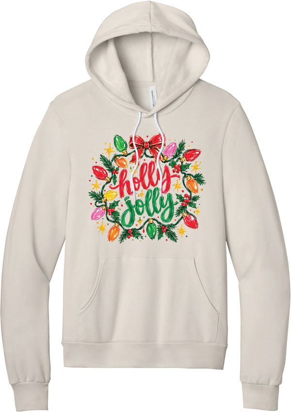 Holly Jolly Christmas Lights hoodie in Heather Dust, featuring hand-lettered holly jolly script framed by vintage Christmas bulb lights, pine, holly berries, and a red bow