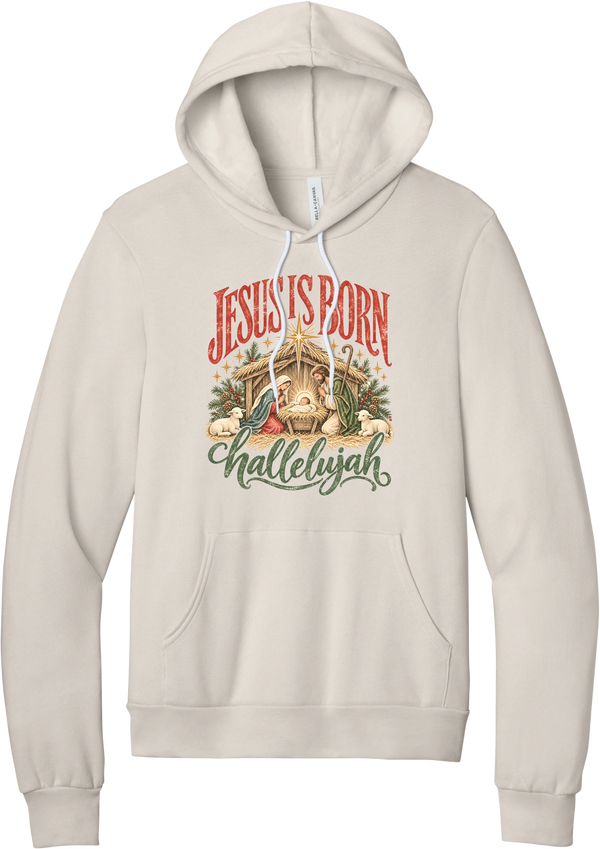 Jesus Is Born Hallelujah hoodie in Heather Dust, featuring a vintage nativity scene under a golden star with Jesus Is Born lettering and Hallelujah script