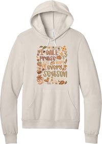 Praise Him Wildflower hoodie in Heather Dust, featuring I Will Praise Him in Every Season in hand lettering surrounded by fall wildflowers, pumpkins, a latte, boots, and Psalm 146:2