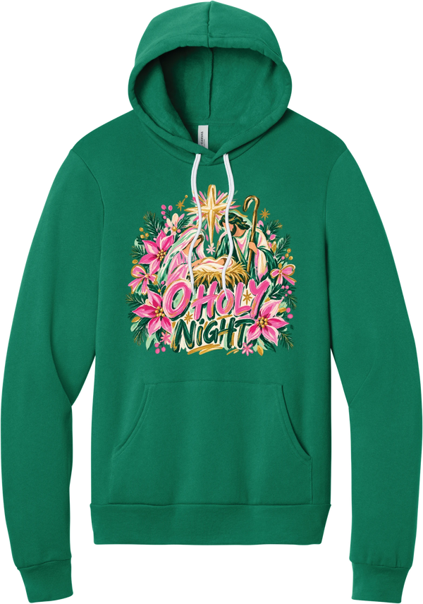 Artful O Holy Night hoodie in Kelly Green, featuring a painted nativity under the star of Bethlehem with O Holy Night lettering framed by pink poinsettias and evergreen