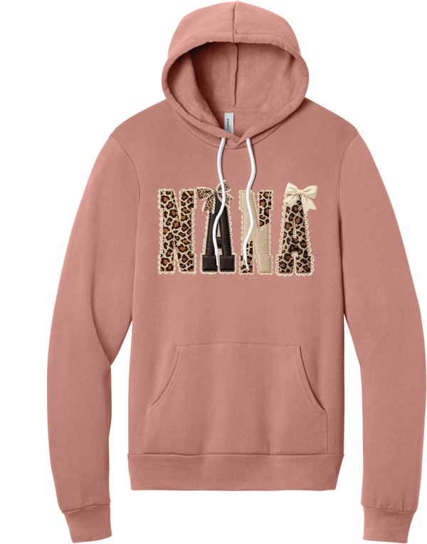 Grandma Leopard Applique hoodie in Mauve, featuring NANA spelled out in leopard, cream, and chocolate patches with a scalloped stitched applique look and two bows