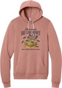 Words Like Honey hoodie in Mauve, featuring Kind Words Are Like Honey lettering over a dripping honeycomb with bees, wildflowers, and Proverbs 16:24