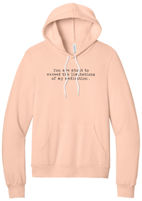 Limitations of My Medication hoodie in Peach, featuring You are about to exceed the limitations of my medication in distressed black typewriter letters