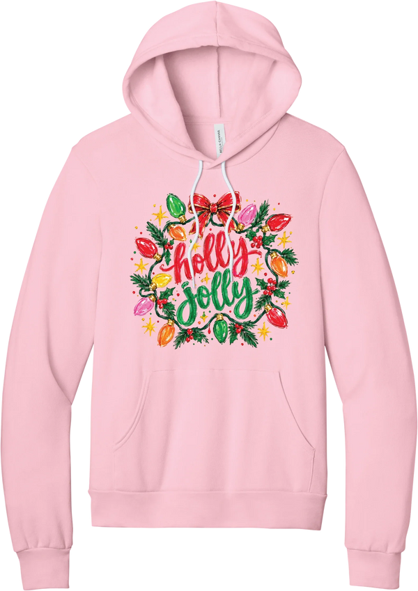 Holly Jolly Christmas Lights hoodie in Pink, featuring hand-lettered holly jolly script framed by vintage Christmas bulb lights, pine, holly berries, and a red bow