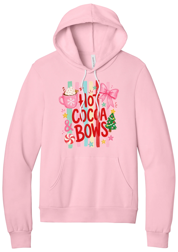 Hot Cocoa and Bows hoodie in Pink, featuring red HOT COCOA and BOWS letters on pastel stripes with a cocoa mug and a pink bow
