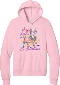 Oh Deer Retro hoodie in Pink, featuring a retro spotted fawn with a holly wreath, pastel stars, and Oh Deer It's Christmas script