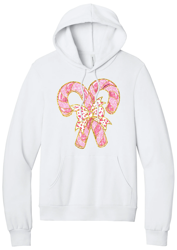 Candy Cane Bow hoodie in White, featuring two pink glitter candy canes tied with a leopard heart bow and gold trim