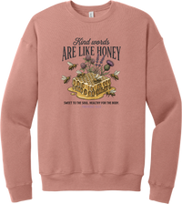 Words Like Honey crewneck sweatshirt in Mauve, featuring a dripping honeycomb with bees and wildflowers under Kind Words Are Like Honey lettering and Proverbs 16:24