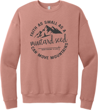 Mustard Seed Faith crewneck sweatshirt in Mauve, featuring a circle badge of mountains and a cross with Faith as Small as a Mustard Seed Can Move Mountains lettering and Matthew 17:20