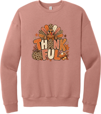 Thankful Leopard Turkey crewneck sweatshirt in Mauve, featuring a leopard and plaid feathered turkey over the word Thankful, with a leopard pumpkin, pie, and autumn leaves