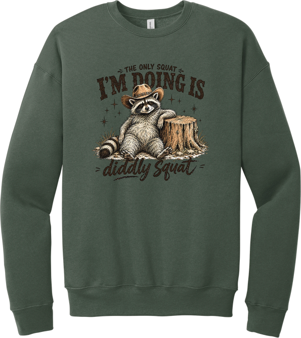Diddly Squat crewneck sweatshirt in Military Green, featuring a cowboy raccoon lounging against a tree stump with The only squat I'm doing is diddly squat