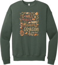 Praise Him Wildflower crewneck sweatshirt in Military Green, featuring I Will Praise Him in Every Season in hand lettering surrounded by fall wildflowers, pumpkins, a latte, boots, and Psalm 146:2