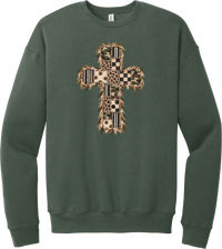 Quilted Patchwork Cross crewneck sweatshirt in Military Green, featuring a patchwork cross in camo, leopard, checkerboard, polka dot, and stripes with a fringed edge