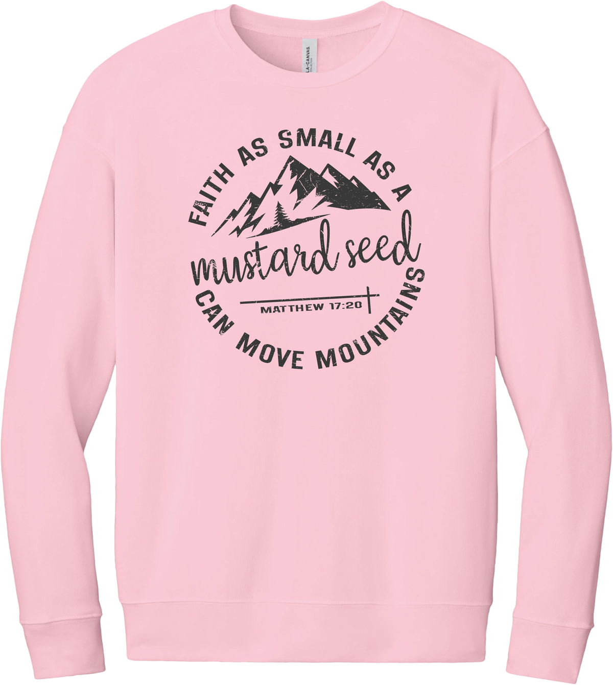 Mustard Seed Faith crewneck sweatshirt in Pink, featuring a circle badge of mountains and a cross with Faith as Small as a Mustard Seed Can Move Mountains lettering and Matthew 17:20