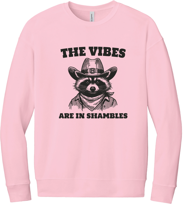 The Vibes Are in Shambles crewneck sweatshirt in Pink, featuring a cowboy raccoon in a bandana with The vibes are in shambles