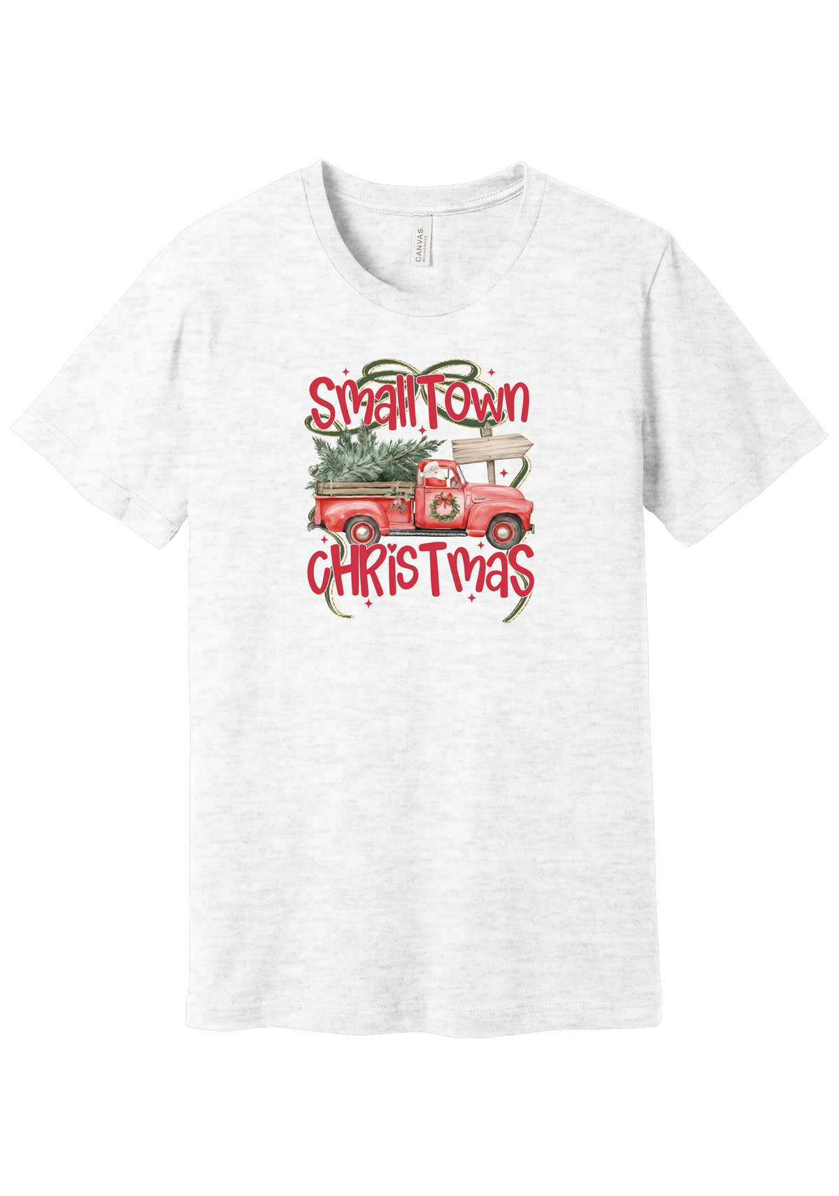 Personalized Small Town Christmas tee in Ash, featuring Santa in a vintage red pickup hauling a Christmas tree past a road sign personalized with your town