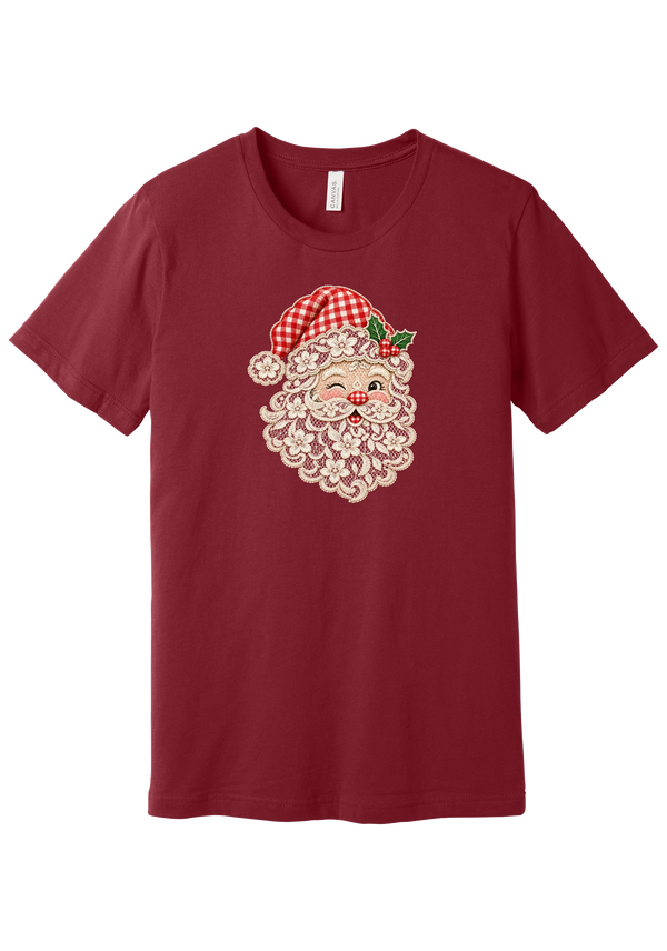Vintage Lace Santa tee in Cardinal, featuring a vintage lace Santa face with a cream floral lace beard, a red gingham hat, and holly