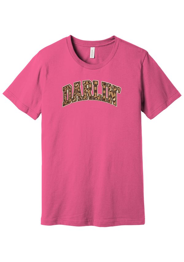 Darlin' tee, Checker Outline design, in Charity Pink, featuring arched varsity DARLIN' letters filled with leopard and checker print