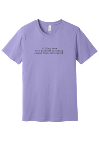 Killing Them With Kindness tee in Dark Lavender, featuring Killing them with kindness is taking longer than anticipated in distressed black typewriter letters