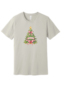 Adore Him Bow Tree tee in Dust, featuring a green Christmas tree dressed in pink bows and a gold star with an Oh Come Let Us Adore Him banner