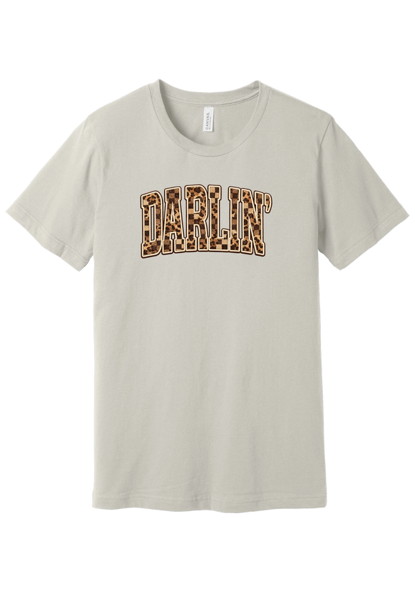 Darlin' tee, Leopard Checker design, in Dust, featuring arched varsity DARLIN' letters filled with leopard and checker print