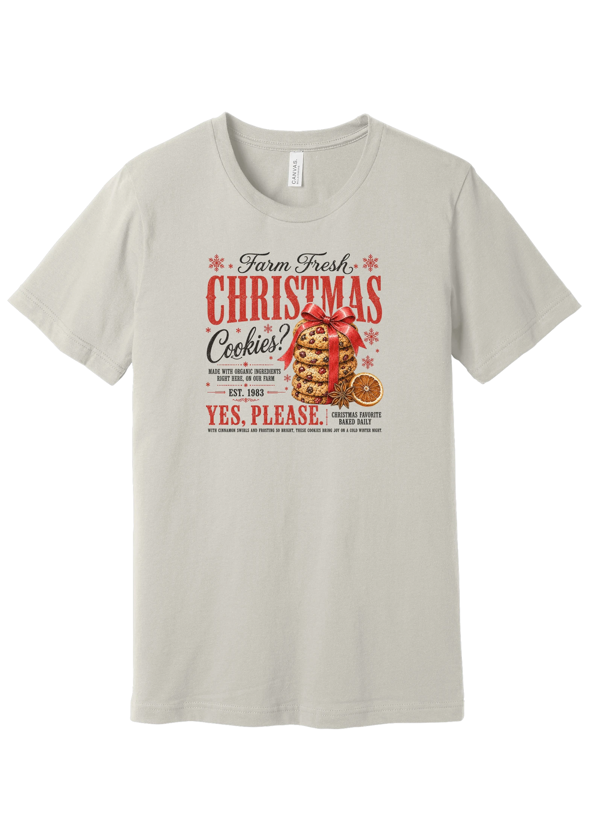 Farm Fresh Christmas Cookies tee in Dust, featuring a vintage farmhouse bakery sign with a stack of Christmas cookies tied in a red ribbon bow