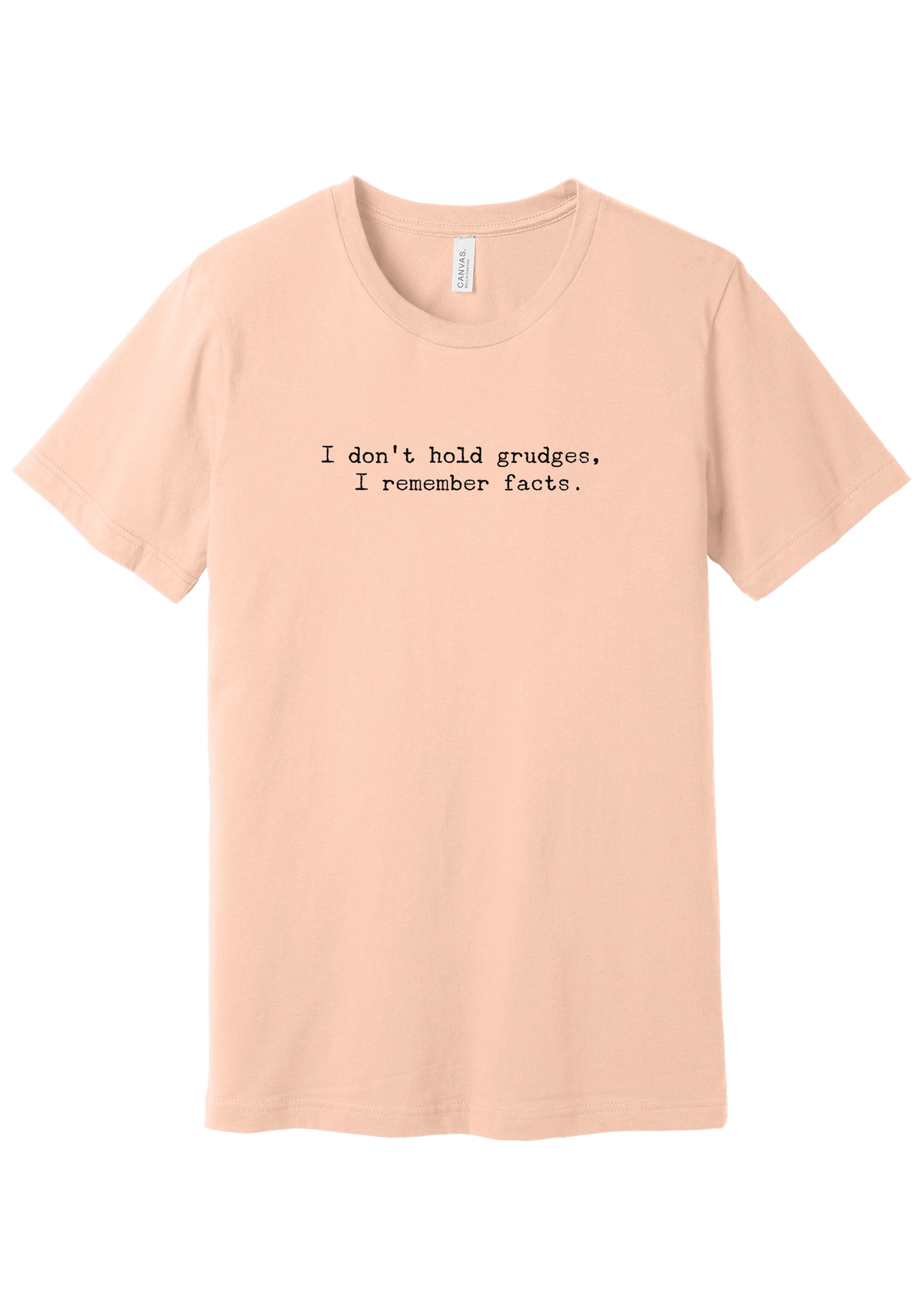 I Don't Hold Grudges tee in Peach, featuring I don't hold grudges, I remember facts in distressed black typewriter letters