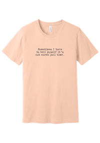 Not Worth Jail Time tee in Peach, featuring Sometimes I have to tell myself it's not worth jail time in distressed black typewriter letters
