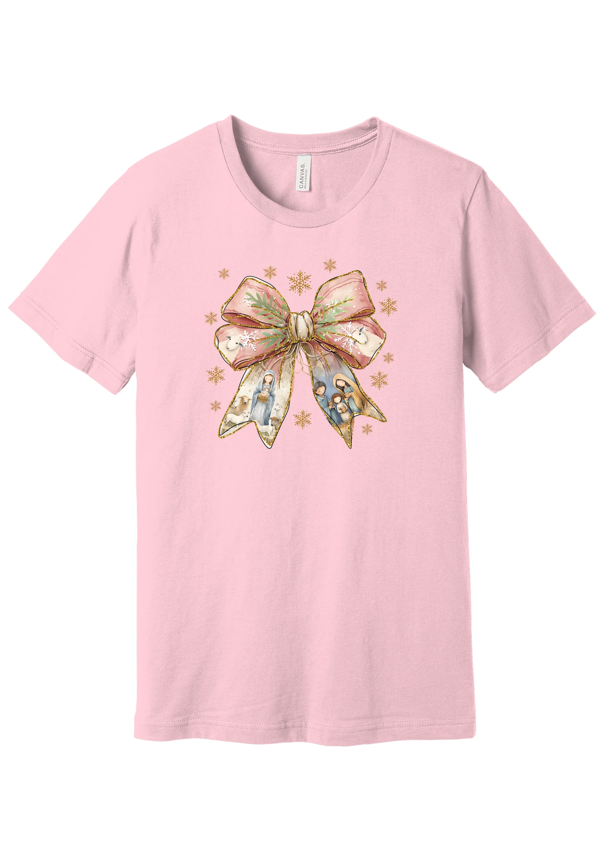 Nativity Bow tee in Pink, featuring a blush satin bow with painted nativity scenes in its ribbons and gold snowflakes