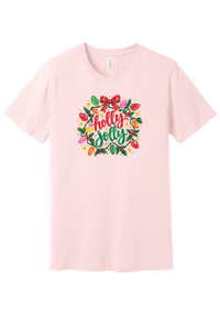 Holly Jolly Christmas Lights tee in Soft Pink, featuring hand-lettered holly jolly script framed by vintage bulb lights, holly, and a big red bow