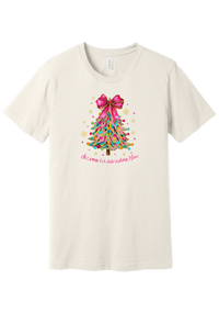 Adore Him Ribbon Tree tee in Vintage White, featuring a colorful ribbon Christmas tree topped with a hot pink bow over Oh Come Let Us Adore Him script