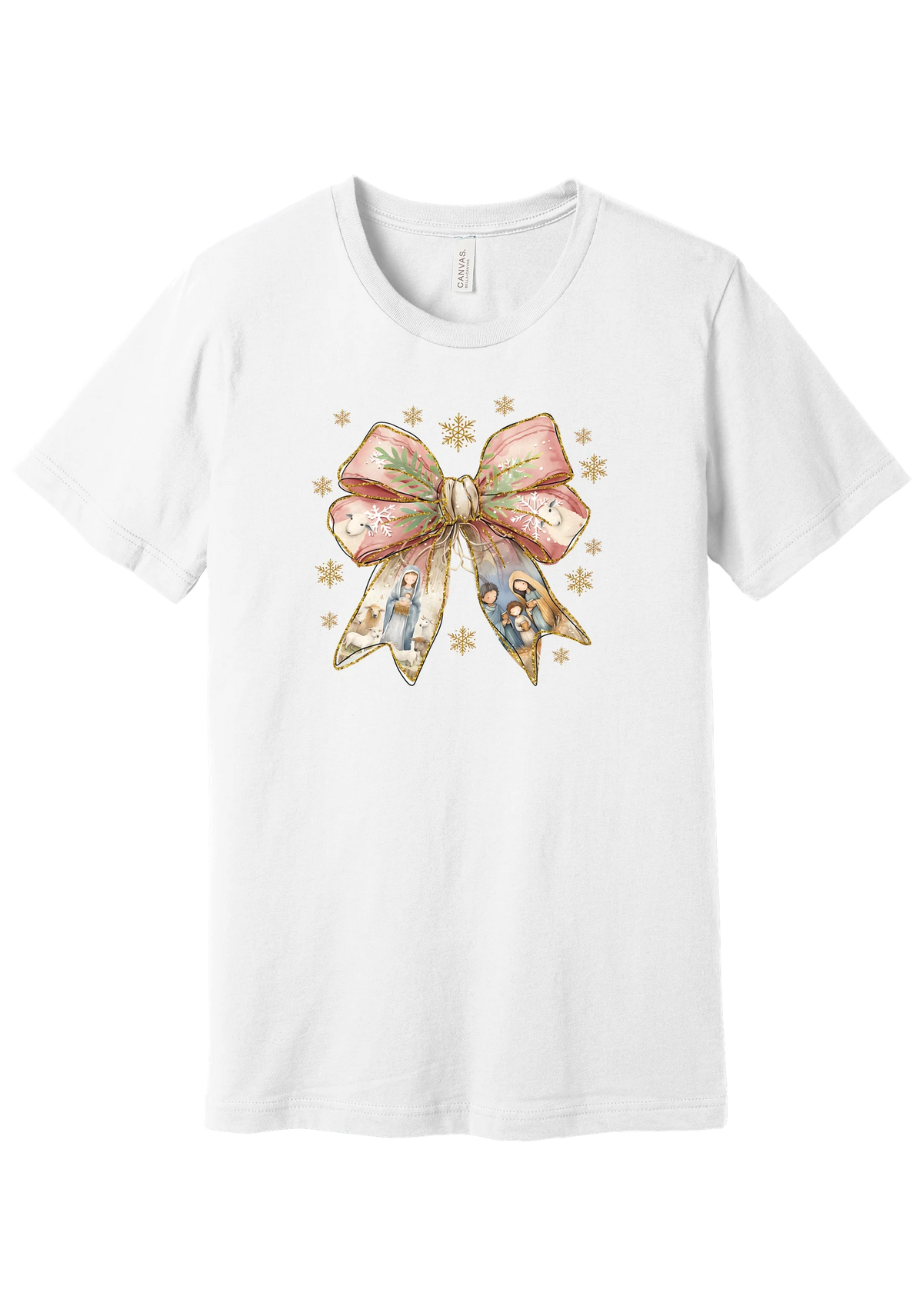 Nativity Bow tee in White, featuring a blush satin bow with painted nativity scenes in its ribbons and gold snowflakes