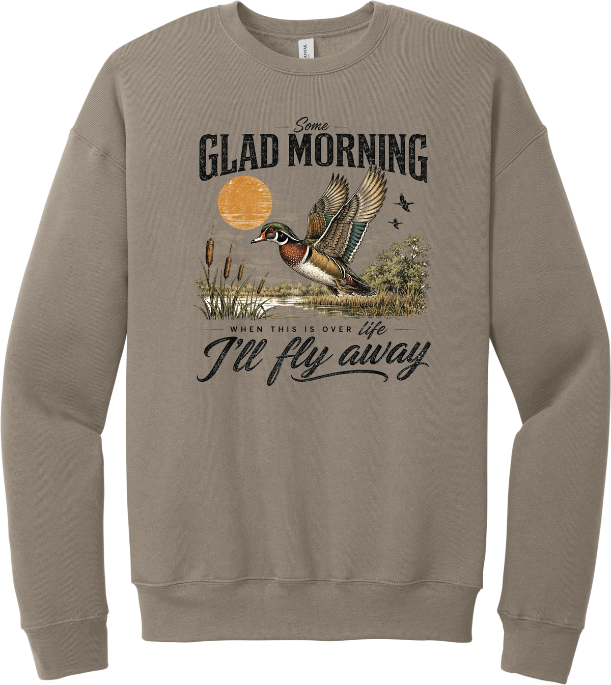Some Glad Morning crewneck sweatshirt in Tan, featuring a hand-painted wood duck taking flight over a marsh at sunrise with Some glad morning when this life is over I'll fly away