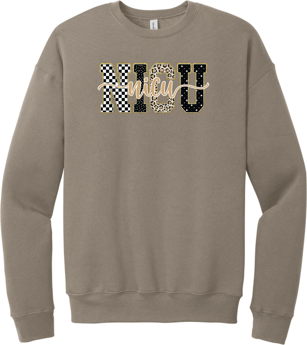 Glitzy Patterned NICU crewneck sweatshirt in Tan, featuring NICU block letters in checkerboard, polka dot, leopard, and starry patterns with a gold glitter outline and nicu script