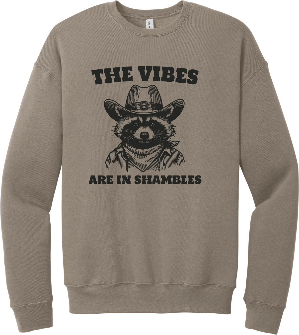 The Vibes Are in Shambles crewneck sweatshirt in Tan, featuring a cowboy raccoon in a bandana with The vibes are in shambles