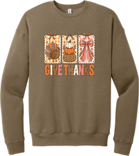 Give Thanks Coquette crewneck sweatshirt in Vintage Brown, featuring three bow-topped stamp panels with a turkey, stacked pumpkins, and a pink bow above Give Thanks in patchwork letters