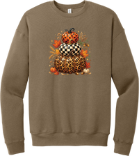 All Stacked Up crewneck sweatshirt in Vintage Brown, featuring three stacked pumpkins in polka dot, checkerboard, and leopard with autumn leaves